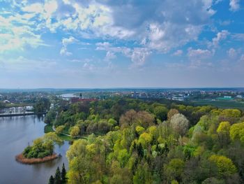 High angle view of river and townscape against sky