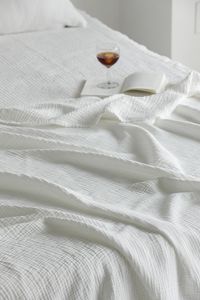 Close-up of white bed