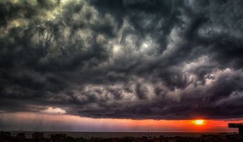 Scenic view of dramatic sky during sunset