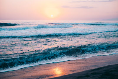 Scenic view of sea against sky during sunset