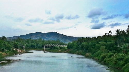 Scenic view of landscape against cloudy sky