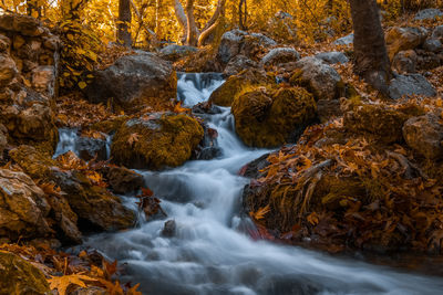 Stream flowing through rocks in sea