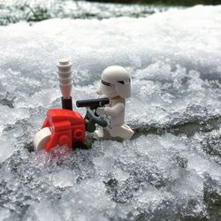 Red toy car in snow