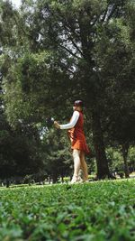 Full length of woman standing on field