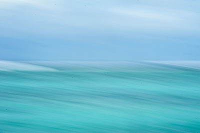 Full frame shot of sea against blue sky