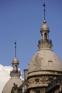 Low angle view of building against blue sky