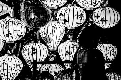 Low angle view of illuminated lanterns hanging at night