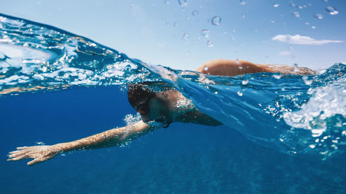 Man swimming in the calm sea