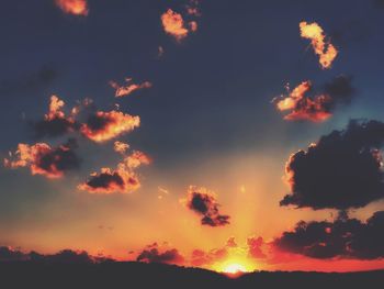 Low angle view of dramatic sky during sunset