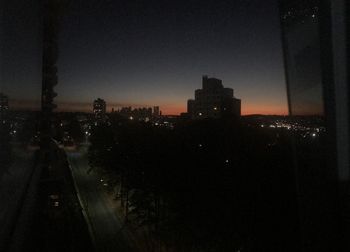 Illuminated buildings in city at night