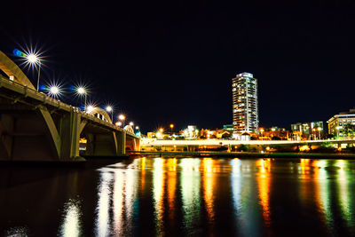 Illuminated buildings in city at night