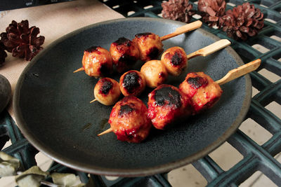 High angle view of meat on barbecue