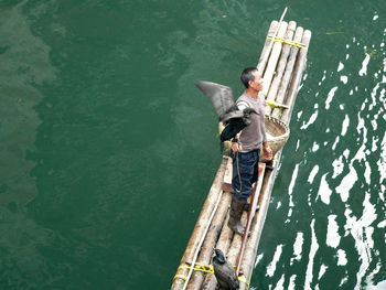 High angle view of man standing in water