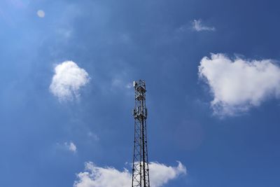 Low angle view of communications tower against sky