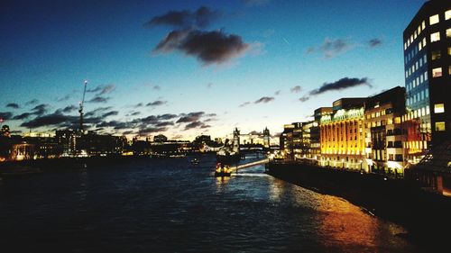 River passing through city at dusk