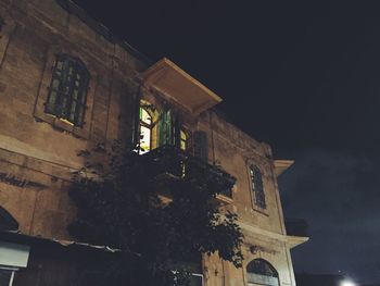 Low angle view of building against sky at night