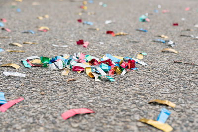 Close-up of multi colored confetti on street