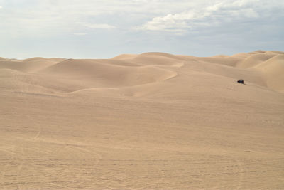 Atv off-road all terrain vehicles driving over the sand dunes for entertainment and recreation