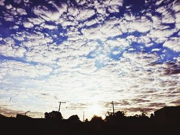 Low angle view of cloudy sky at sunset