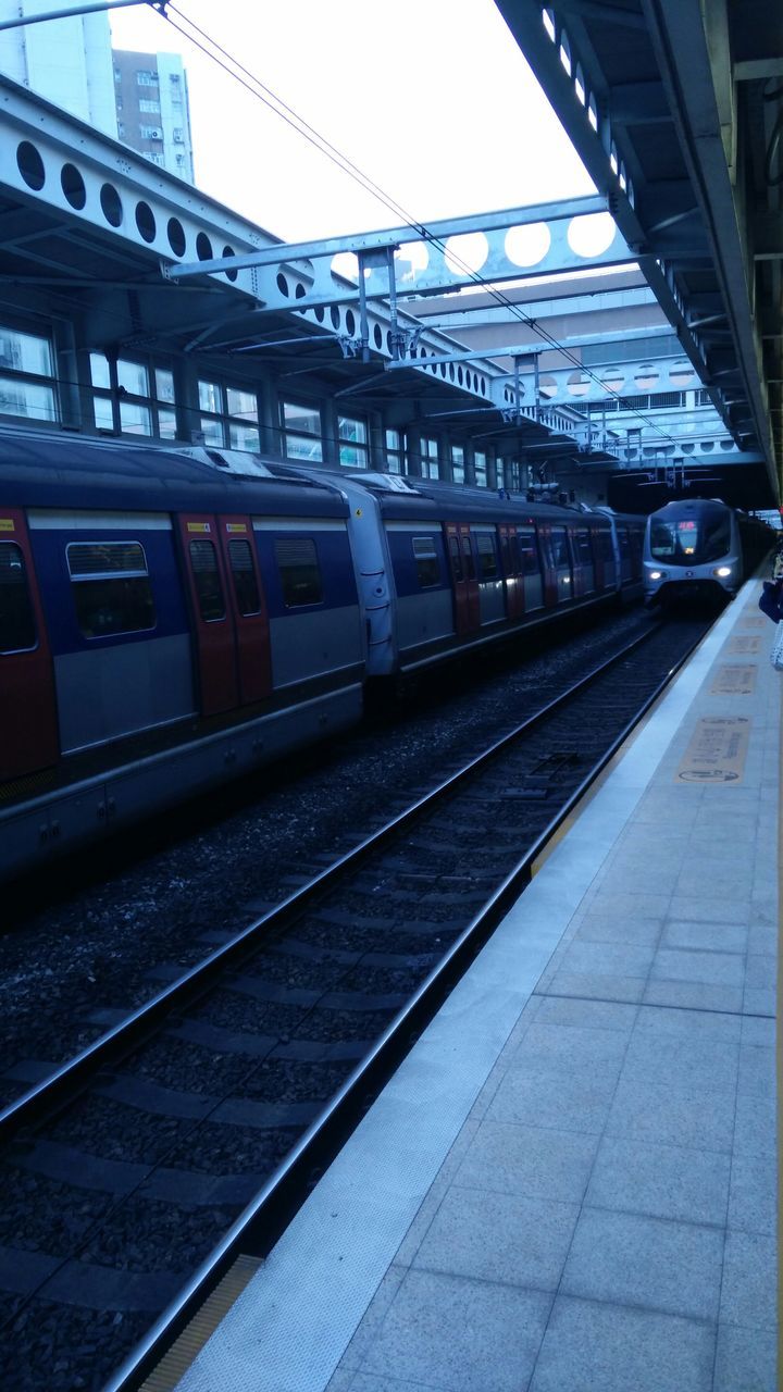 railroad track, transportation, rail transportation, public transportation, railroad station platform, railroad station, train - vehicle, passenger train, mode of transport, train, travel, built structure, public transport, architecture, railway track, connection, railway station, journey, sky, diminishing perspective