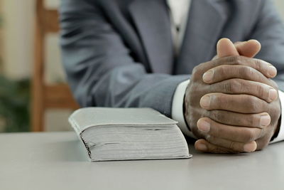 Praying to god for forgiveness caribbean man praying  with people stock image stock photo