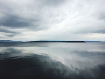 Idyllic shot of cloudy sky reflection in lake