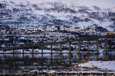 Bridge over river during winter