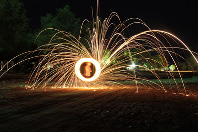 Light painting against sky at night