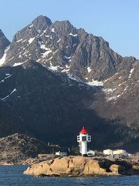 Lighthouse on mountain against sky
