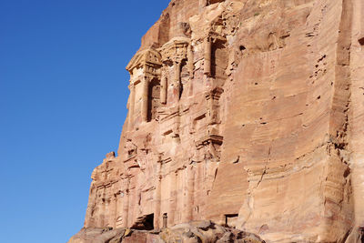 Low angle view of rock formation against clear sky