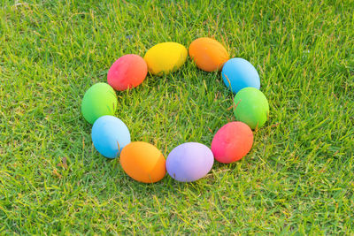 High angle view of easter eggs on grassy field