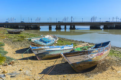 Boats moored at beach