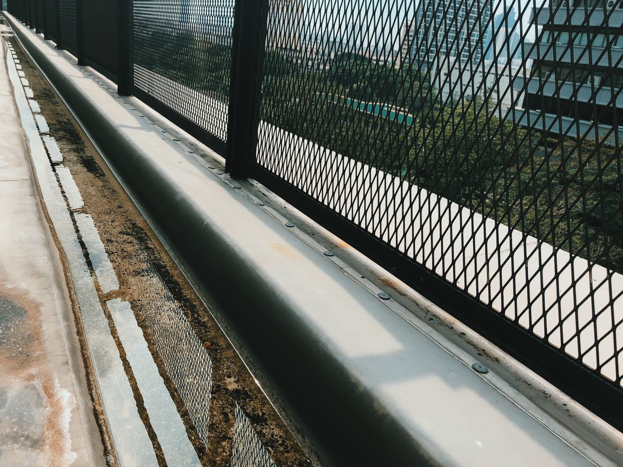 HIGH ANGLE VIEW OF RAILROAD STATION PLATFORM SEEN THROUGH WINDOW