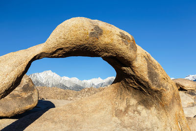 Low angle view of rock formation against clear sky