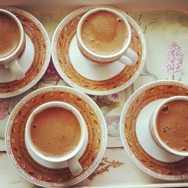 coffee cup, indoors, drink, coffee - drink, refreshment, saucer, food and drink, coffee, table, still life, cup, freshness, high angle view, frothy drink, directly above, close-up, cappuccino, froth art, no people, brown