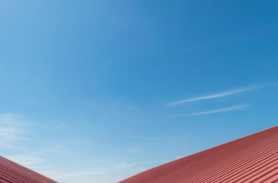 Low angle view of building against blue sky