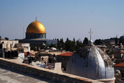 Panoramic view of city buildings against clear sky