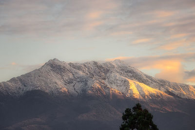 Low angle view of mountain against sky during sunset