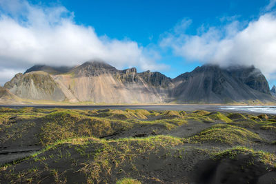 Scenic view of landscape and mountains against sky