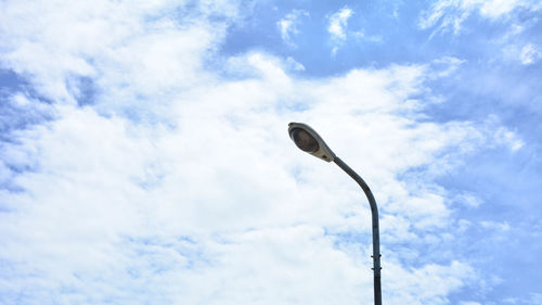 Low angle view of street light against sky