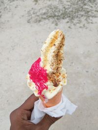 Hand holding ice cream cone