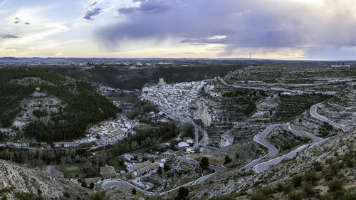 Aerial view of cityscape against sky during sunset