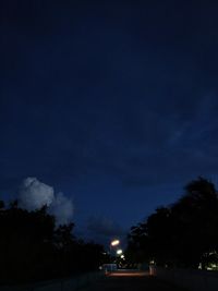 Low angle view of illuminated building against sky at night