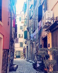 Narrow street amidst buildings in town
