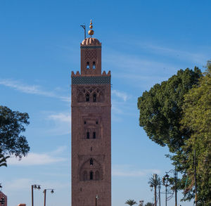 Low angle view of tower against blue sky