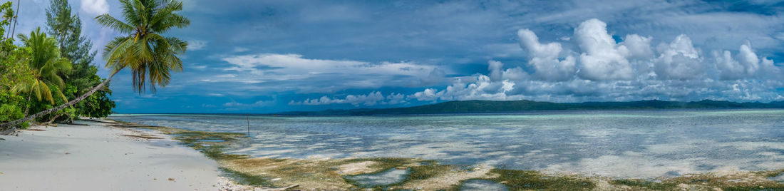 Panoramic view of beach against sky