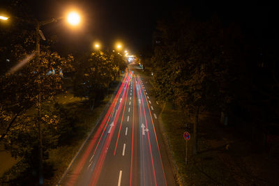 High angle view of light trails on road at night