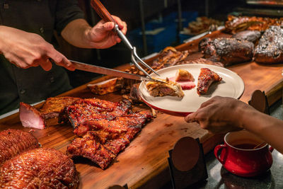 High angle view of people preparing food on table