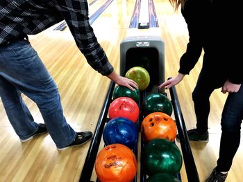 Low section of people standing on multi colored