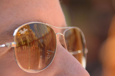 Close-up of man holding sunglasses